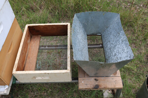 Left shaker box is made from a bee box. The right shaker box is made from riveted galvanized sheet metal to keep the surface somewhat slippery.